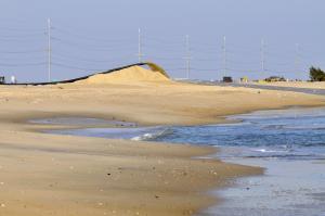 The beach north of the Indian River Inlet bridge took a major hit from Hurricane Sandy. State officials say disaster relief funds are needed to rebuild the beach and dunes. BY RON MACARTHUR