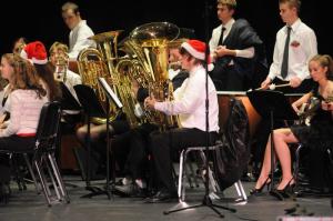 Wearing  the proper holiday hat is  tuba   player Neal   Brinton.  Shown are (l-r)  Chase Evans, Kearney  Mallon,   Brinton, Gary   Brown,  Bobby Braun and  Kelsey Buckingham.