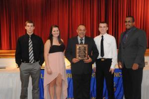 The Junior Firefighters presented an Appreciation Award to Ed Schaeffer for his hard work improving the program. Shown are (l-r) Jacob Slater, Taylor Cirrilo, Schaeffer, Robby Rogers and Michael Arnett. BY STEVEN BILLUPS