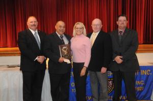 The Firefighter of the Year Award was presented to Ed Schaeffer. Shown are (l-r) Woody Magee, Ed Schaeffer, Patty Scaheffer, Bob Nicholson and Troy Virden. BY STEVEN BILLUPS