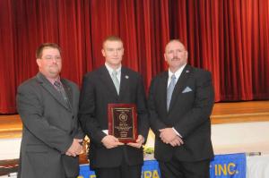 Aiden Gause, center, was presented with the President's Award by Past President Troy Virden, left, and 2013 President Woody Magee. BY STEVEN BILLUPS