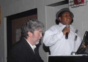 Justin Wheeler sings “I Know Where I’ve Been” at the piano with teacher John Gause.