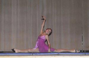 Hadara Aiello finishes up her second-place winning gymnastics routine with the splits.