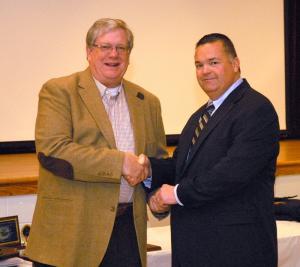 Rehoboth Beach Mayor Sam Cooper, left, receives his 40-year membership pin from President Gary Bailey. BY WARREN JONES