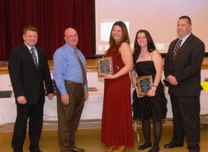 Chief Harry Miller presents the Appreciation Award to members of the career staff, for off-duty help at fundraising events. Shown (l-r) are Assistant Chief Chatam Marsh, Chief Harry Miller, Career Firefighter/Emergency Medical Technician Clara Warwick, Career FF/EMT Teri Willey and President Gary Bailey. BY WARREN JONES
