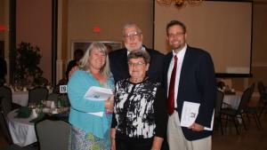All in the Family: in back are Coach Ralph Baird and Ralph Baird, Jr.; in front are Debbie Baird Warrington and Suzanne Baird. BY KEITH MISINER