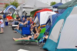 It's a tent city as customers wait for the newest Chick-fil-A to open. BY RON MACARTHUR