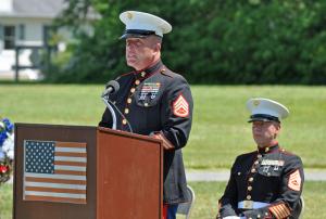 Staff Sgt. Hank Rickards introduces his friend and guest speaker Gunnery Sgt. James Keefer. BY NICK ROTH