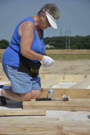 Carolyn Kline, preparing to resume work on the house, will soon be part of the self-help program, thanks to the encouragement of her daughter.