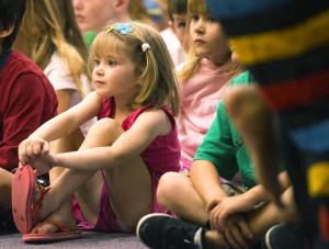Erin Noonan, 3, is thrilled by the drummers and dancers of the Sankofa African group. BY DENY HOWETH