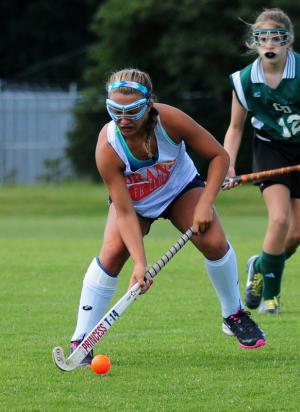Beacon's Annie Judge moves the ball into the scoring circle. BY DAN COOK