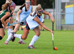 Beacon's Marcella Sabbagh dribbles the ball into the Vikings offensive zone. BY DAN COOK