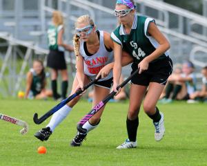 Beacon's Jody Boyer battles a CD Rams defender. BY DAN COOK