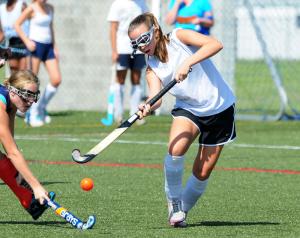 Mariner eighth-grader Lori Ferguson makes a play on a loose ball. BY DAN COOK