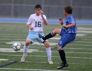 Cape's Sam Evans, left, blocks a Sussex Academy pass. BY DAN COOK