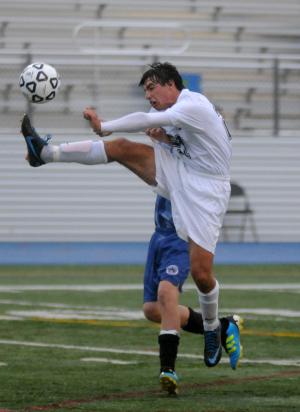 Cape sophomore Toby Fleming gets big air to control a high pass. BY DAN COOK