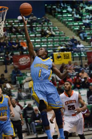 Cape forward Jon Jon Warren lays in a finger roll in the Vikings' loss to the Knights. Warren scored 16 points in the contest. BY DAN COOK