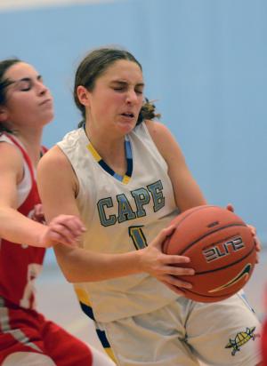 Cape guard Madison MacElrevey gets intense with Smyrna's Alyson                   Davis. BY DAN COOK