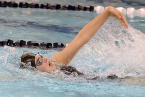 Molly Weeks swims the backstroke leg of the individual medley. BY DAN COOK
