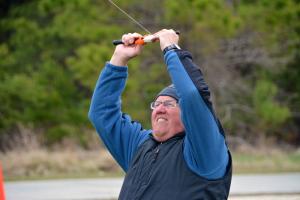 Don Baker of Lewes works hard to get one of his grandchildren's kites into the air. BY RON MACARTHUR