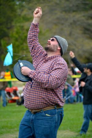 Ben Huggett of Philadelphia lets his kite fly during the high-flying competition. BY RON MACARTHUR