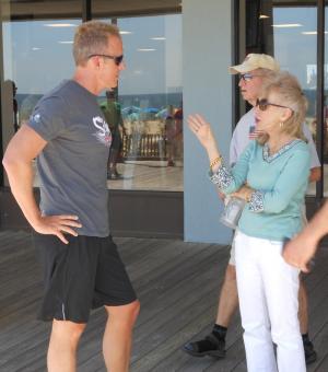 Chris Schell, of the Schell Brothers, and Jay Stein's wife Dian chat before the walk and run. BY CHRIS FLOOD