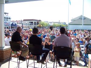 Mike Bagley, Jeff Gordon and Sam Calagione face the crowd at the Rehoboth Beach Bandstand Aug. 20. BY RYAN MAVITY