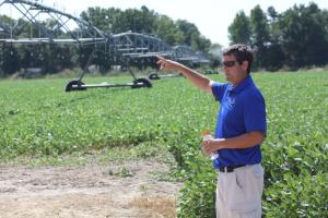 Cory Whaley, agriculture extension agent for the University of Delaware, talks about a pivot above-ground irrigation system. BY MELISSA STEELE