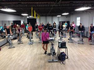 Elaine Dernoga stands in front of her class before embarking on a two-hour spin class, the 1,000th of her spinning career. BY SUBMITTED PHOTO