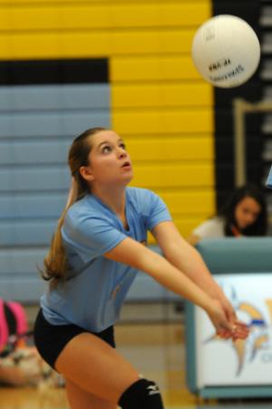 Beacon's Isabella Leishear bumps a dig. BY DAN COOK