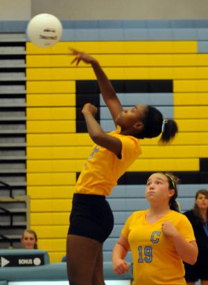 Mariner's Niya Mosley spikes a kill. BY DAN COOK