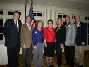 Republican supporters and candidates (l-r) State Senate District 21 candidate Bryant Richardson, Sussex County Council District 5 candidate Rob Arlett, U.S. Senate candidate Kevin Wade's wife Gail Wade, SCRWC First Vice President Kathy Watts, Sussex County Register of Wills Cindy Green, Sussex County Sheriff candidate Robert T. Lee and State Rep. Harvey Kenton, R-Milford, pose for a photo Oct. 22 before hearing a presentation on human trafficking at a Sussex County Republican Women's Club dinner meeting. BY MADDY LAURIA