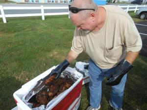 Bob Shields of Greenwood stuffs coolers full of cooked chicken. He's a patron member of Post 2931. BY CHRIS FLOOD