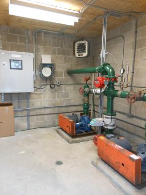 The pump house was refurbished with a new roof, reconditioned pump motors and most importantly a PLC was installed – the big gray box to the left – that allows for the irrigation system to work without being manually turned on. BY CHRIS FLOOD