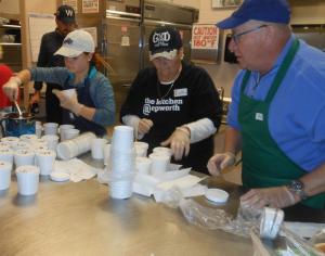 The church also offered carry-out platters for individuals and families. Here (l-r) Morgan Harris of Rockville, Md., church member Rose Barcellona and Al Sloane of Rockville, Md., get to-go containers ready. BY CHRIS FLOOD