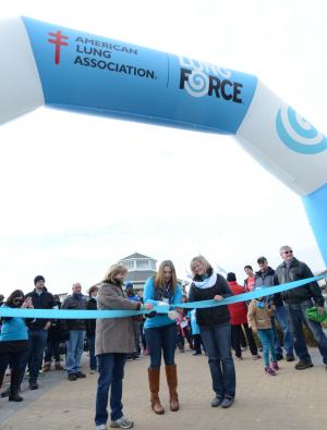Shown (l-r) Deb Hamilton, board member; Amanda Carl, LUNG FORCE Walk chair; Deborah Brown, CEO of the American Lung Association of the Mid-Atlantic; cut the ribbon to begin the walk. BY DENY HOWETH