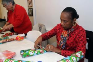 Cape Henlopen Senior Center member Shirley Riley stays busy wrapping items for the program. BY STEVEN BILLUPS