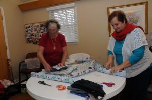With plenty of items left to wrap, Nellie Shaffer, left, and Helen Capodano keep on wrapping. BY STEVEN BILLUPS