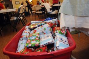 Volunteers stay busy trying to fill as many of these boxes as possible. BY STEVEN BILLUPS