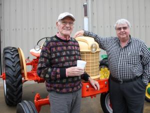 Joe Hudson, left, and Allen Chorman stand in front of a Case tractor Allen restored. "These are the kind of tractors we used when I first went to work for Joe on his farms when I was 10 years old." Despite extensive farming experience, the two are known more for their careers as pilots. In 2013, the Delaware Aviation Hall of Fame inducted the two friends and colleagues into its ranks. BY DENNIS FORNEY