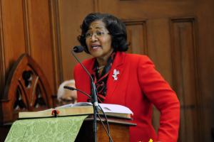 Janie Miller welcomes the congregation to the Rev. Martin Luther King Jr. Celebration. BY DAN COOK