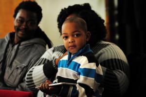 Josiah Collins,3, enjoys the worship service. BY DAN COOK