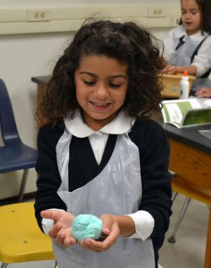 Worcester Prep kindergartner Mia Jaoude of Lewes admires the beautiful slime she created. SOURCE SUBMITTED