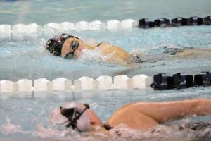Cape's Madison Caldwell and her Sussex Tech opponent keep an eye on each other as they swim the 200 meter freestyle. Caldwell won the heat. BY DAN COOK