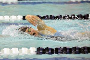 Cape sophomore Molly Weeks breaks the record in the 100 freestyle with a time of 1:01.18. BY DAN COOK