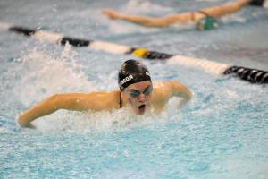 Sophomore Amelia Nigh-Johnson pulls ahead of the competition and wins the 100 butterfly with a time of 1:09.20. BY DAN COOK