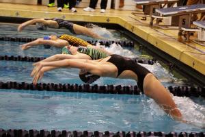 Sarah Rambo leaves the blocks to start the 200 medley relay, in which she and teammates Sarah Hyde, Molly Weeks and Amelia Nigh-Johnson set a new meet record with a 2:07.86, breaking a record set in 2003 of 2:08.51. BY DAN COOK