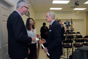 Chatting prior to the press conference are (l-r) Glenn Rollins, IRS tax consultant; Jacklyn Quinn, Delaware Community Reinvestment Action Council resource developer; and U.S. Sen. Tom Carper. BY STEVEN BILLUPS