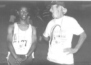 Lesham helps coach Darin Oates at the 1999 Special Olympics World Summer Games. COURTESY SPECIAL OLYMPICS