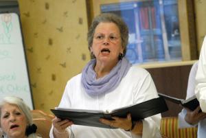 Ellen Clemens projects her voice to the roomful of residents. BY STEVEN BILLUPS